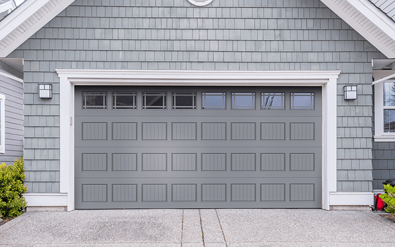 Invicta short carriage house door in gray with prairie windows